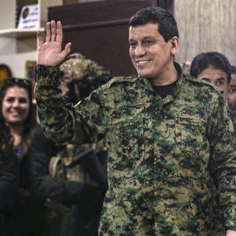 Syrian Democratic Forces (SDF) commander-in-chief Mazloum Kobane waves after giving a press conference in Syria's northeastern city of Hasakeh on Dec. 6, 2024.