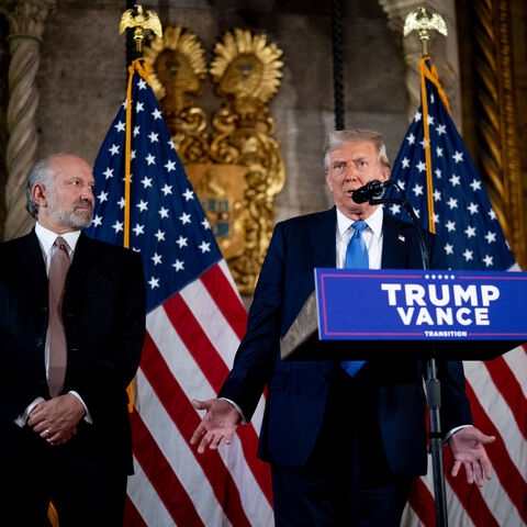 PALM BEACH, FLORIDA - DECEMBER 16: U.S. President-elect Donald Trump, accompanied by Trump's choice for Secretary of Commerce, Cantor Fitzgerald Chairman and CEO Howard Lutnick, speaks at a news conference at Trump's Mar-a-Lago resort on December 16, 2024 in Palm Beach, Florida. In a news conference that went over an hour, Trump announced that SoftBank will invest over $100 billion in projects in the United States including 100,000 artificial intelligence related jobs and then took questions on Syria, Israe