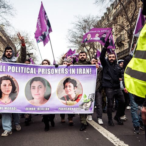 People carry a banner during a march demanding truth and justice for Kurdish activists, Paris, Jan. 11, 2025.