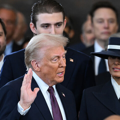 WASHINGTON, DC - JANUARY 20: Donald Trump is sworn into office as Melania Trump holds the Bible in the U.S. Capitol Rotunda on January 20, 2025 in Washington, DC. Donald Trump takes office for his second term as the 47th president of the United States. (Photo by Saul Loeb - Pool/Getty Images)