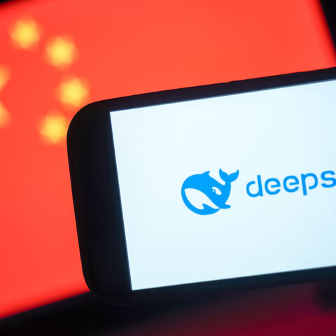 In this photo illustration, the DeepSeek logo is seen on a phone in front of a flag of China, Hong Kong, Jan. 28, 2025.