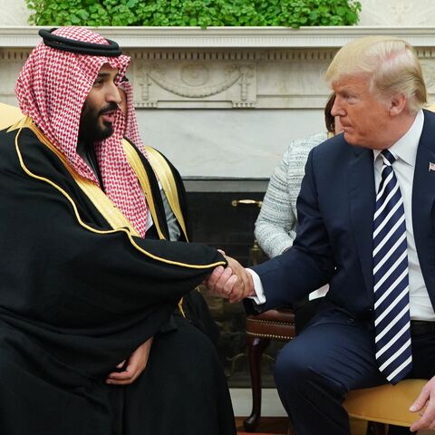 US President Donald Trump (R) shakes hands with Saudi Crown Prince Mohammed bin Salman in the Oval Office of the White House, Washington, DC, March 20, 2018.