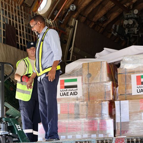 Workers unload aid from an aircraft upon it's arrival from the United Arab Emirates at the Port Sudan airport, on May 5, 2023. - Air strikes and gunfire rocked the Sudanese capital on May 5 as fighting showed no signs of abating, despite the threat of renewed US sanctions and warnings of a "protracted" conflict. (Photo by Giuseppe CACACE / AFP) (Photo by GIUSEPPE CACACE/AFP via Getty Images)