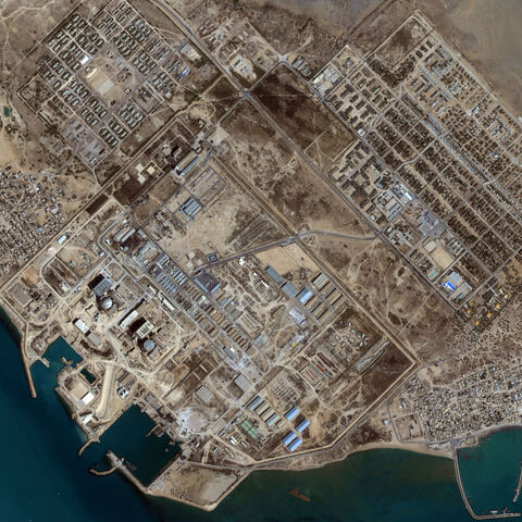 In SPACE - MAY 19: This image captured by a satellite on May 19, 2001 shows the Bushehr Reactor in Iran. The nuclear facility is located approximately 17 kilometers south of the city of Bushehr. The reactor complex occupies a 2.5 Square Kilometer site area, which includes assembly halls, a concrete channel for cooling water that runs from the reactors to the Gulf, and a the harbor, which supports loading and unloading of foreign materials needed for construction and reactor operation. There are two reactor 