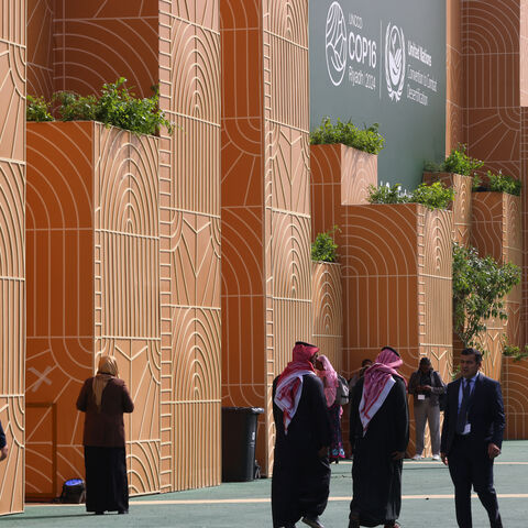 Delegates arrive for the opening session of the United Nations Convention to Combat Desertification, UNCCD COP16, in the Saudi capital Riyadh on December 2, 2024. Saudi Arabia is hosting the COP16 UN conference on land degradation and desertification as the top oil exporter pitches itself as an environmental defender despite criticism of its role at climate talks. (Photo by Fayez Nureldine / AFP) (Photo by FAYEZ NURELDINE/AFP via Getty Images)