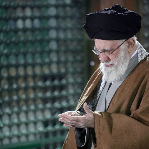 This handout picture provided by the office of Iranian Supreme Leader Ayatollah Ali Khamenei shows him praying inside the tomb of the late Supreme Leader Ayatollah Ruhollah Khomeini in Tehran on Jan. 30, 2025. 