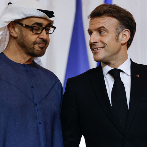 UAE President Sheikh Mohamed bin Zayed al-Nahyan (L) and French President Emmanuel Macron talk as they attend an agreement signing ceremony as part of Zayed al-Nahyan's visit to France at the presidential Elysee palace in Paris, on Feb. 6, 2025. 