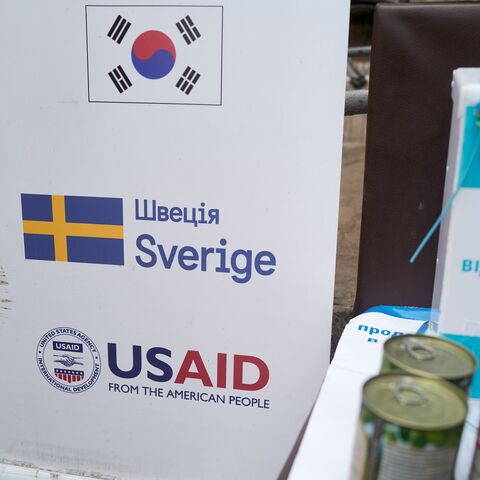 A banner lists the countries funding the World Food Program at a food distribution point run by the Ukrainian charity Angels of Salvation (AOS), on Feb. 7, 2025, in Druzhkivka, Ukraine.