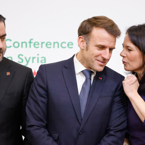 France's President Emmanuel Macron (C), Germany's Foreign Minister Annalena Baerbock (R) and Syria's Minister of Foreign Affairs Asaad Hassan al-Shaibani pose for a group photograph during the International Conference on Syria at the Ministerial Conference Center, in Paris on February 13, 2025. (Photo by Ludovic MARIN / POOL / AFP) (Photo by LUDOVIC MARIN/POOL/AFP via Getty Images)