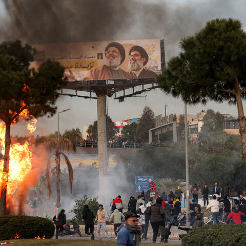 Teargas fumes erupt during clashes between supporters of the Lebanese Shiite Islamist movement Hezbollah and the Lebanese Army amidst a Hezbollah-organised rally to block the road to Beirut International Airport over a decision to bar two Iranian flights from landing there, in Beirut on February 15, 2025. An AFP correspondent said tear gas was fired to disperse crowds on February 15 after again blocking amidst calls by the Iran-backed group for a sit-in. (Photo by IBRAHIM AMRO / AFP) (Photo by IBRAHIM AMRO/