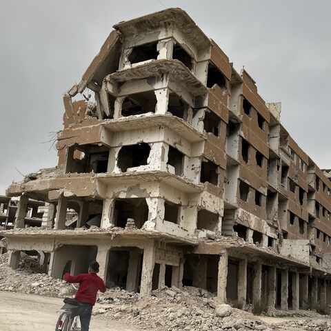 Residents are slowly returning to Daraya, the Damascus suburb that was reduced to rubble by the Assad regime. Here a child is seen riding his bike in Daraya on Jan. 26, 2025. (Amberin Zaman/Al-Monitor)