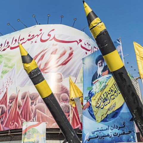A pickup truck is carrying two Iranian missile mockups during a rally that marks the 46th anniversary of Iran's 1979 Islamic Revolution in Tehran, Iran, on Feb. 10, 2025.