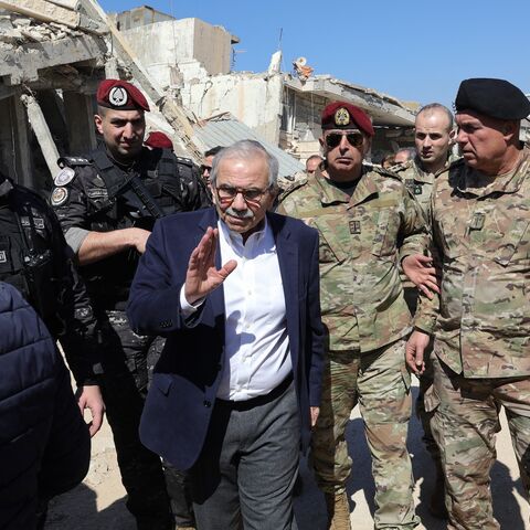 Lebanon's Prime Minister Nawaf Salam walks among Lebanese army soldiers as he visits the southern village of Khiam near the border with Israel, on Feb. 28, 2025.