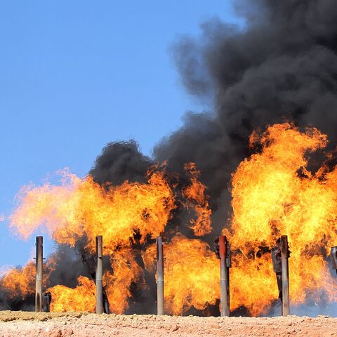 A picture taken on Oct. 17, 2017, shows excess flammable gasses burning from gas flares at the Havana oil field, west of the multiethnic northern Iraqi city of Kirkuk.