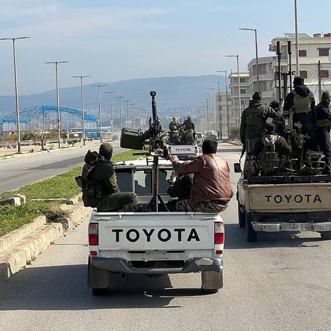 A handout picture from the Syrian state news agency SANA showing members of the security forces in Syria's coastal region