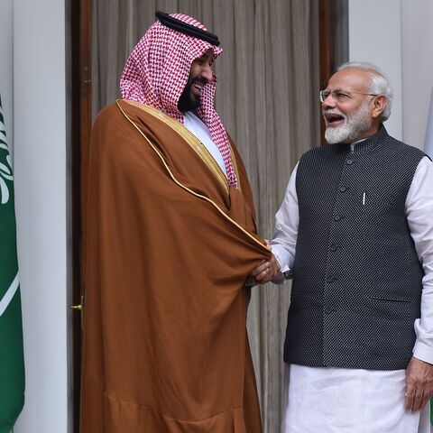 Indian Prime Minister Narendra Modi (R) shakes hands with Saudi Crown Prince Mohammed bin Salman prior to a meeting at Hyderabad House in New Delhi on Feb. 20, 2019.
