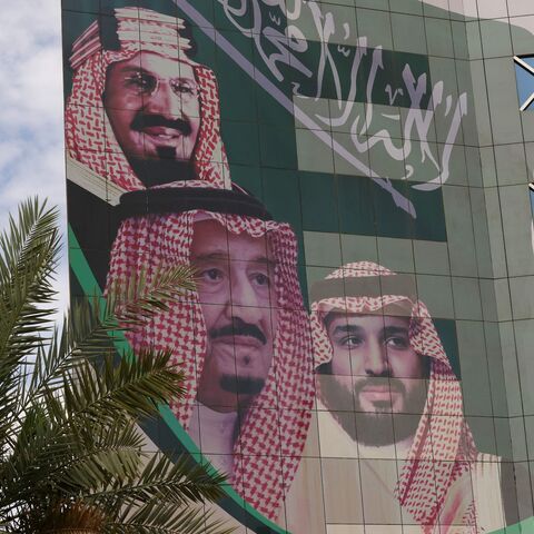This picture shows a poster depicting King Abdulaziz bin Saud (L), the founder of the modern kingdom of Saudi Arabia, King Salman bin Abdulaziz (C), and Crown Prince Mohammed in Riyadh on April 16, 2023.