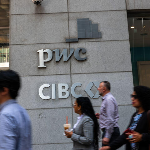 NEW YORK, NEW YORK - SEPTEMBER 12: People walk by PricewaterhouseCoopers (PwC) New York headquarters after the company announced a major restructuring on September 12, 2024 in New York City. PwC LLP will let go of up to 1,800 US employees next month as the accounting firm shifts to in-house technology developers and streamlines its advisory practice. (Photo by Spencer Platt/Getty Images)