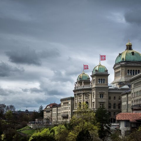 This photograph taken on April 3, 2024, shows the House of Swiss Parliament under heavy clouds in Swiss capital Bern.