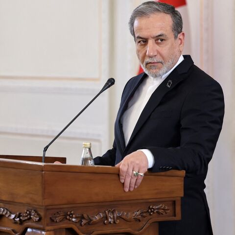 Iran's foreign minister, Abbas Araghchi (R), and Oman's foreign minister, Sayyid Badr al-Busaidi, give a joint press conference in Tehran on Dec. 30, 2024.