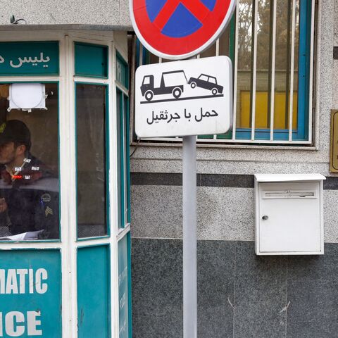 A policeman guards the entrance of the Azerbaijan Embassy in Tehran on Jan. 27, 2023, following an attack.