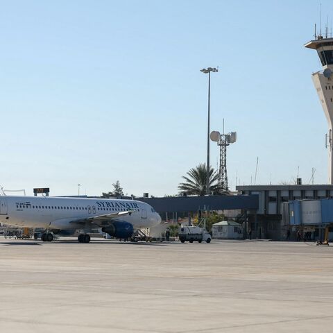 This picture shows a Syrian Arab Airlines Airbus A320-200 aircraft and the control tower at Damascus international airport as the new Syrian authorities prepare to reopen it, on December 16, 2024.