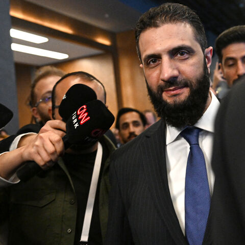 Syria's interim President Ahmed al-Sharaa (C) leaves a bilateral room after his meeting with Qatar's Minister of Foreign Affairs during the Antalya Diplomacy Forum, in Antalya, on April 11, 2025. (Photo by Ozan KOSE / AFP) (Photo by OZAN KOSE/AFP via Getty Images)