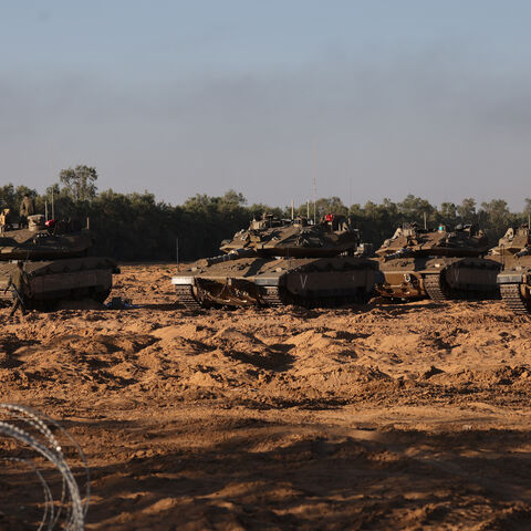 Israeli army tanks are deployed at a position near Israel's border with the Gaza Strip, on May 5, 2025. Israel was issuing orders to call up tens of thousands of reservists ahead of an expanded offensive in Gaza, Israeli media reported on May 3, as Prime Minister Benjamin Netanyahu attacked truce mediator Qatar. (Photo by Menahem KAHANA / AFP) (Photo by MENAHEM KAHANA/AFP via Getty Images)