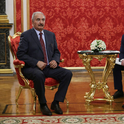 In this pool photograph distributed by Russian state agency Sputnik, Russia's President Vladimir Putin (R) and Libya's eastern military strongman Khalifa Haftar (L) attend their meeting in Moscow on May 10, 2025, during celebrations of the 80th anniversary of the Soviet Union's victory over Nazi Germany in World War Two. (Photo by Gavriil GRIGOROV / POOL / AFP) (Photo by GAVRIIL GRIGOROV/POOL/AFP via Getty Images)