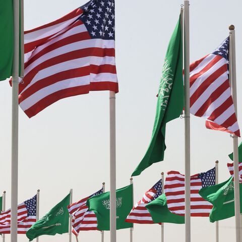Saudi and US flags flutter on a main road in Riyadh on May 12, 2025, hours before of a visit by US President Donald Trump to the desert kingdom this week. 