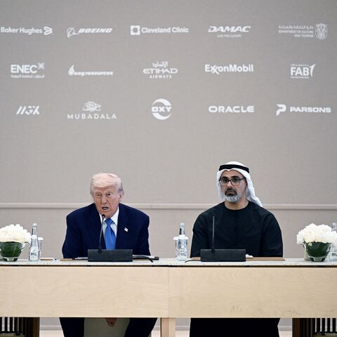 US President Donald Trump and Abu Dhabi Crown Prince Sheikh Khaled bin Mohamed bin Zayed Al Nahyan (2nd R) attend a business forum in Abu Dhabi, May 16, 2025.