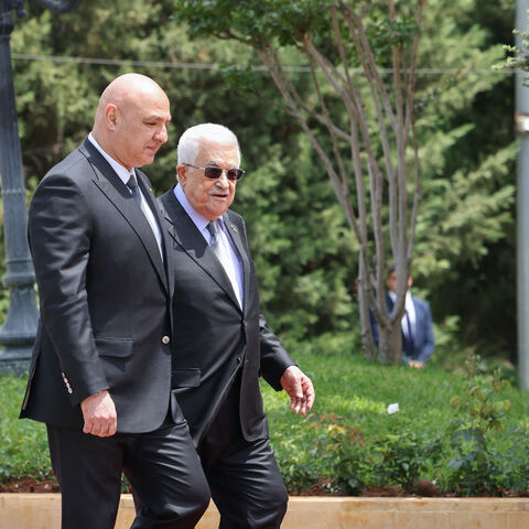 Lebanese President Joseph Aoun (2nd L) walks alongside Palestinian Authority President Mahmud Abbas as they review an honour guard at the Presidential Palace in Baabda, on May 21, 2025.