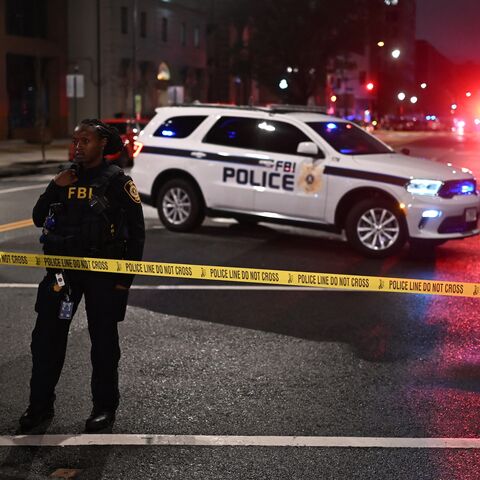 FBI agents cordon off the scene outside the Capital Jewish Museum following a shooting that left two people dead, in Washington, DC, in the early hours of May 22, 2025.