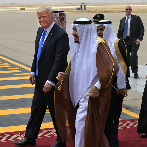 US President Donald Trump (C-L) is welcomed by Saudi King Salman bin Abdulaziz Al Saud (C) upon arrival at King Khalid International Airport, followed by First Lady Melania Trump (R), Riyadh, Saudi Arabia, May 20, 2017.