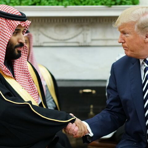 President Donald Trump shakes hands with Saudi Arabia's crown prince, Mohammed bin Salman, in the Oval Office of the White House on March 20, 2018.