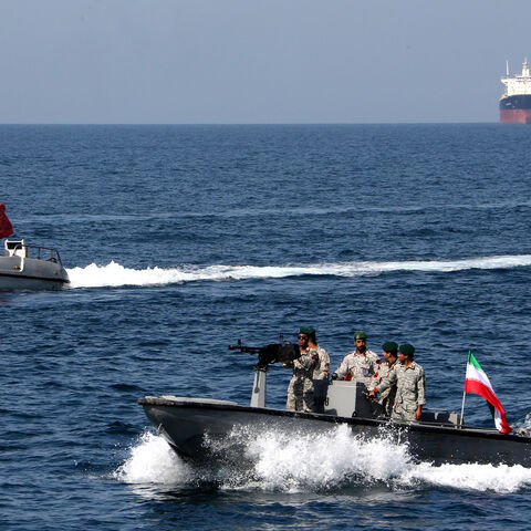 Iranian soldiers take part in the "National Persian Gulf day" in the Strait of Hormuz, on April 30, 2019. The date coincides with the anniversary of a successful military campaign by Shah Abbas the Great of Persia in the 17th century, which drove the Portuguese navy out of the Hormuz Island, after which is named the waterway which separates the Gulf from the Sea of Oman. (Photo by ATTA KENARE / AFP) (Photo by ATTA KENARE/AFP via Getty Images)
