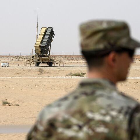 A member of the US Airforce looks on near a Patriot missile battery at the Prince Sultan air base in Al-Kharj, in central Saudi Arabia on February 20, 2020. (Photo by Andrew CABALLERO-REYNOLDS / POOL / AFP) (Photo by ANDREW CABALLERO-REYNOLDS/POOL/AFP via Getty Images)