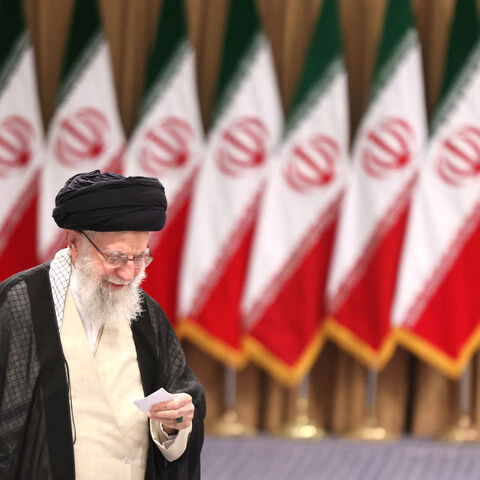 Iran's supreme leader Ayatollah Ali Khamenei prepares to cast his ballot during the runoff of the presidential elections in Tehran on July 5, 2024. (Photo by ATTA KENARE / AFP) (Photo by ATTA KENARE/AFP via Getty Images)