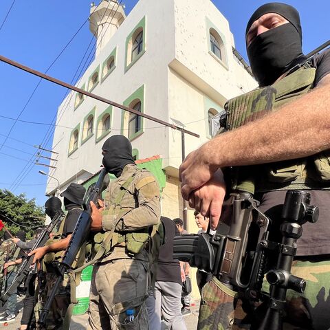 Armed and masked men attend the funeral of two militants from the Popular Front for the Liberation of Palestine in Ain el-Hilweh refugee camp near Sidon on Nov. 1, 2024.