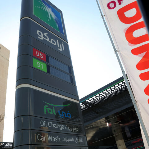 CORRECTION / A picture taken in Riyadh shows the sign in Arabic of an Aramco gas station on the outskirts of the Saudi capital Riyadh on November 5, 2024. Energy giant Saudi Aramco reported a 15 percent year-on-year drop in third quarter profit on November 5, 2024, citing low oil prices. (Photo by Fayez Nureldine / AFP) / "The erroneous mention[s] appearing in the metadata of this photo by Fayez Nureldine has been modified in AFP systems in the following manner: changing the second phrase to refer to Saudi 