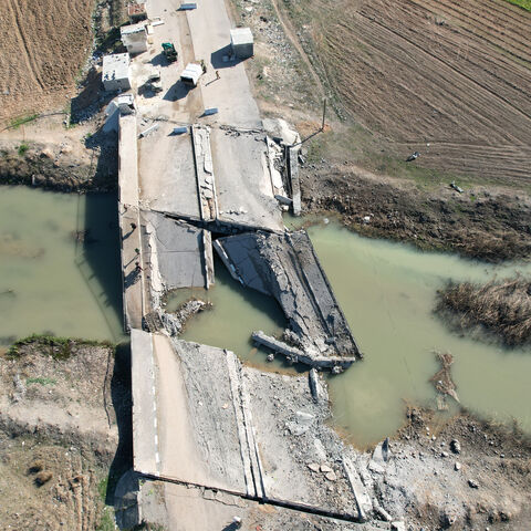 An aerial view shows a bridge, destroyed in an Israeli airstrike, in the town of in Qusayr in Syria's central Homs province on December 14, 2024. Islamist-led rebels took Damascus in a lightning offensive on December 8, ousting president Bashar al-Assad and ending five decades of Baath rule in Syria. (Photo by AAREF WATAD / AFP) (Photo by AAREF WATAD/AFP via Getty Images)