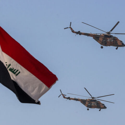 Iraqi Air Force helicopters perform during Army Day celebrations, marking the 104th anniversary of the founding of the Iraqi army, at the Camp Taji military base north Baghdad, on January 6, 2025. The Iraqi armed forces were established by the United Kingdom during their mandate over Iraq after World War I. (Photo by AHMAD AL-RUBAYE / AFP) (Photo by AHMAD AL-RUBAYE/AFP via Getty Images)