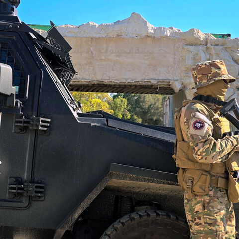 Libyan security forces stand guard at the entrance of Abu Salim Zoo as workers carry out maintance work in the capital Tripoli on May 28, 2025. From May 12 to 15, the Libyan capital was rocked by fighting between an armed group aligned with the Tripoli-based government and factions it has sought to dismantle. Relative calm has since returned, but the situation remains highly volatile as calls grow for the resignation of Dbeibah (Photo by AFP) (Photo by -/AFP via Getty Images)