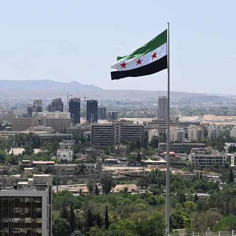 A large Syrian flag flutters above Tishreen Park in Damascus, on June 4, 2025.