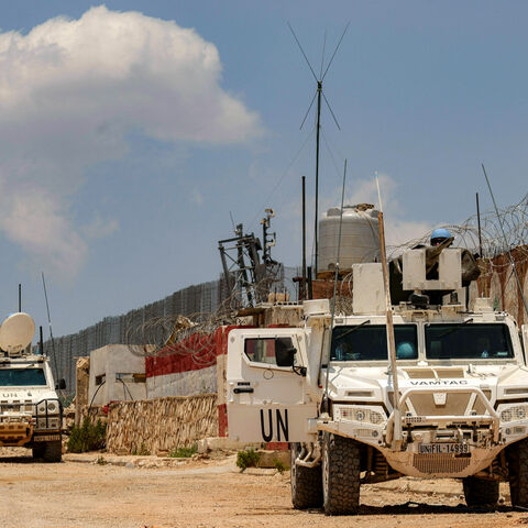 Peacekeepers of the United Nations Interim Force in Lebanon (UNIFIL) ride in armoured vehicles during a patrol along the border with Israel by the village of Kfar Kila in south Lebanon on June 4, 2025. (Photo by AFP) (Photo by -/AFP via Getty Images)