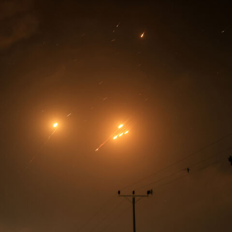 Debris of missiles fired from Iran toward Israel leave trails in the night sky over the Gaza Strip after being intercepted on June 13, 2025. (Photo by AFP) (Photo by -/AFP via Getty Images)