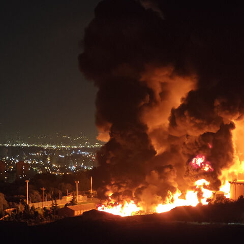 Fire and smoke rise into the sky after an Israeli attack on the Shahran oil depot, Tehran, Iran, June 15, 2025.