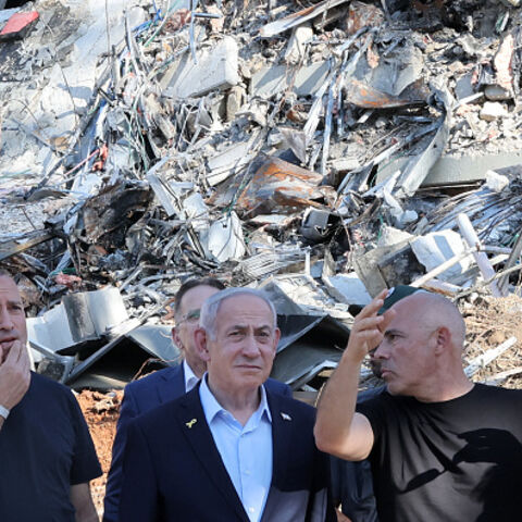 Israel's Prime Minister Benjamin Netanyahu is briefed by Professor Alon Chen, President of the Weizmann Institute of Science, as he visits the facility's site which was hit by an Iranian missile barrage, in the central city of Rehovot on June 20, 2025. (Photo by Jack GUEZ / POOL / AFP) (Photo by JACK GUEZ/POOL/AFP via Getty Images)