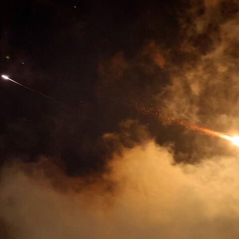 Rocket trails are seen in the sky above the Israeli coastal city of Netanya amid a fresh barrage of Iranian missile attacks on June 21, 2025. Israel's war with Iran entered its second week with the Israeli military chief warning of a "prolonged campaign" and Tehran ruling out further nuclear talks with the United States until Israel halts its attacks. (Photo by JACK GUEZ / AFP) (Photo by JACK GUEZ/AFP via Getty Images)