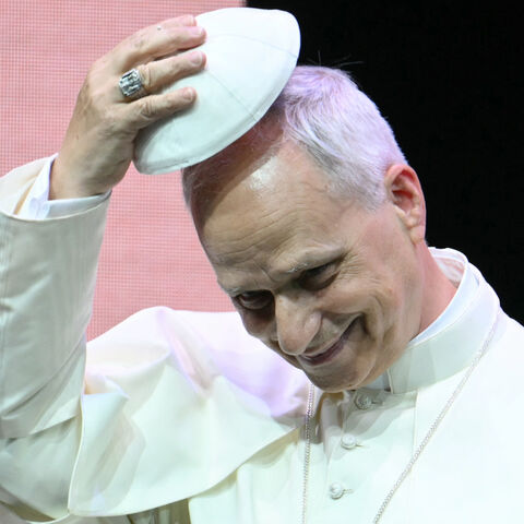 Pope Leo XIV exchanges skullcap (zucchetto) during an audience to the participants in the Meeting of Priests promoted by the Dicastery for the Clergy at the auditorium Conciliazione in Rome on June 26, 2025. (Photo by Alberto PIZZOLI / AFP) (Photo by ALBERTO PIZZOLI/AFP via Getty Images)